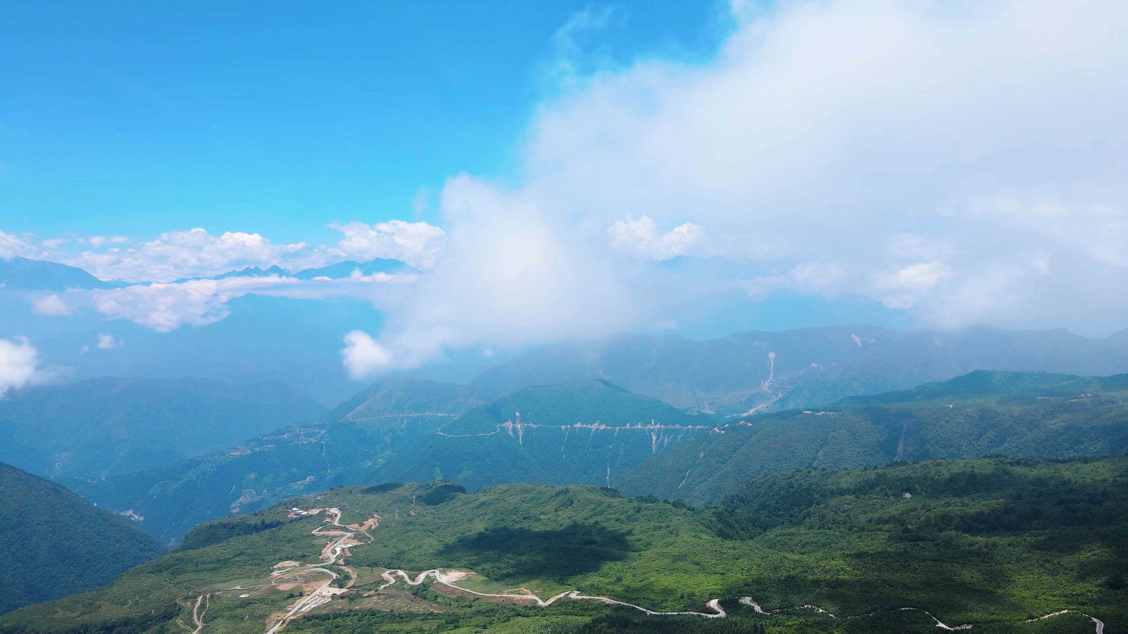 遙望貢嘎千峰雪石棉王崗坪景區